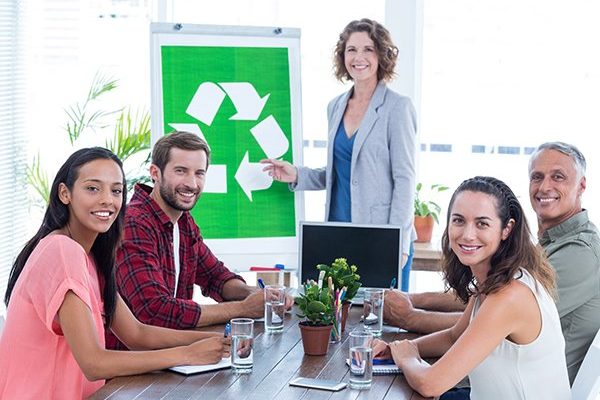 Young creative team having a meeting about recycling in creative office