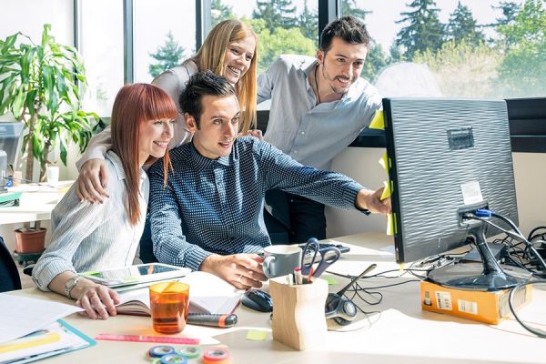 Group of young people employee workers with computer in urban alternative studio - Business concept of human resource and fun on working time - Start up entrepreneurs at office - Bright vintage filter